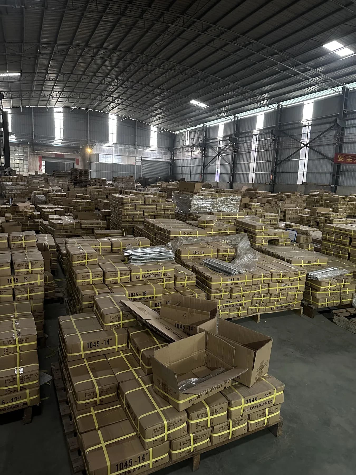 Palletized product boxes stored in the WANYILONG warehouse